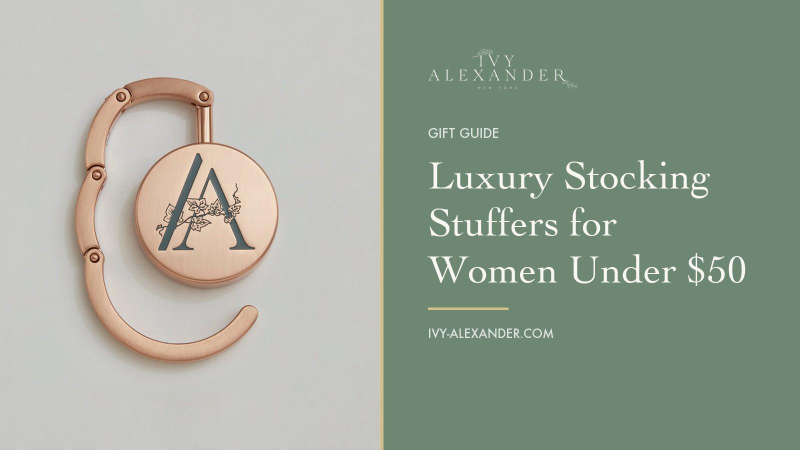 The Ivy Alexander Olivia hook in brushed rose gold, open, beside the title Luxury Stocking Stuffers for Women Under $50 on a sage green panel.